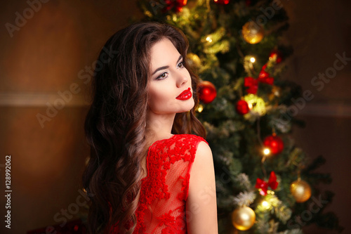Christmas Santa. Beautiful smiling woman model. Makeup. Healthy