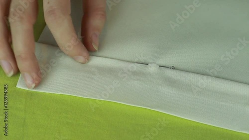 Tailor Stabs Edge of Product by Dressmaker Pins. Sewing of Curtains From Beige Fabric.