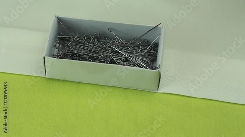 Tailor Removes the Safety Pin From the Box Where Dressmaker Pins Lie.