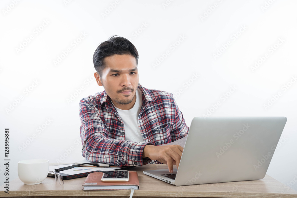 business man with laptop notebook and smartphone in the office business man with laptop notebook and smartphone in the office