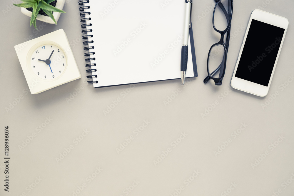 Desk above office desk with notebook and stationery Desk above office desk with notebook and stationery
