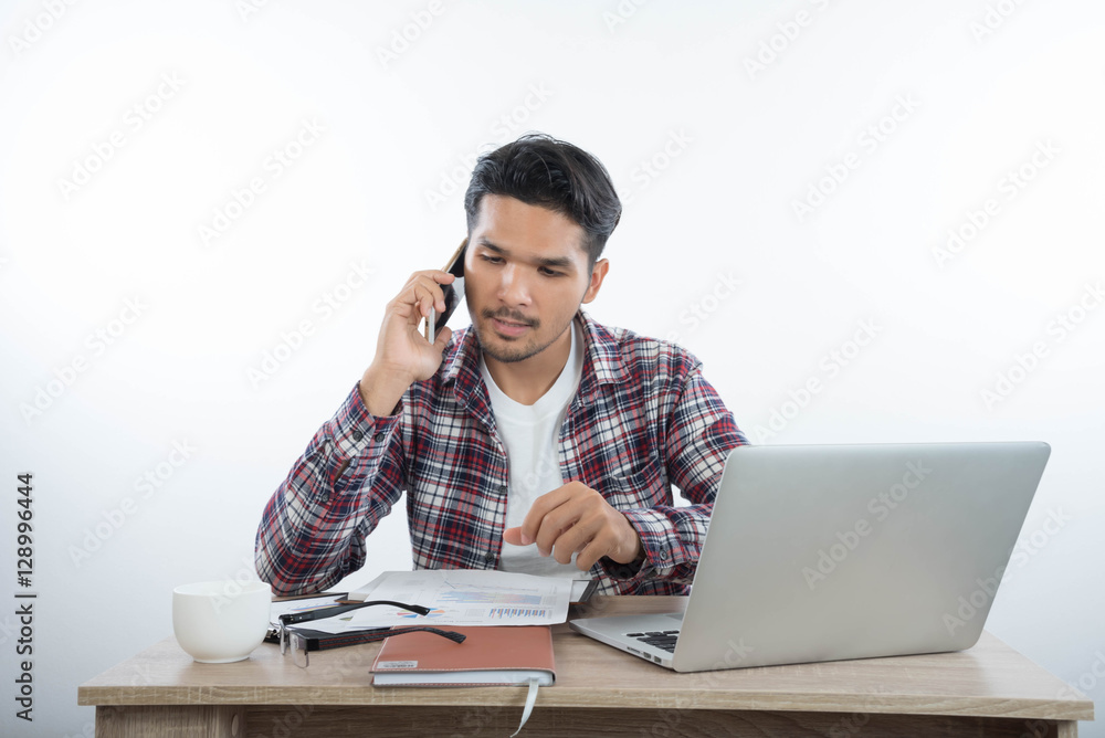 business man with laptop notebook and smartphone in the office business man with laptop notebook and smartphone in the office