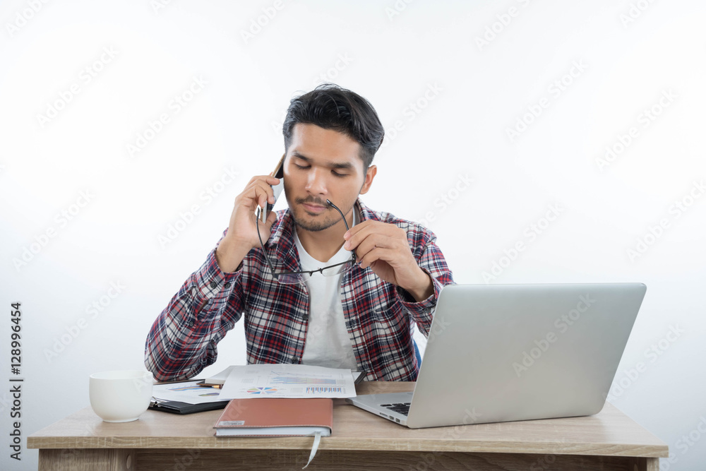 business man with laptop notebook and smartphone in the office business man with laptop notebook and smartphone in the office