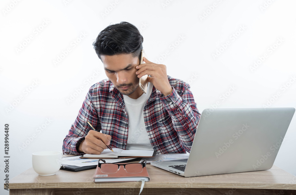 business man with laptop notebook and smartphone in the office business man with laptop notebook and smartphone in the office