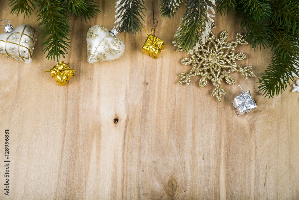 Silver snowflakes and fir branches on a wooden table. Christmas Silver snowflakes and fir branches on a wooden table. Christmas