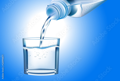 Pouring water from bottle into glass on blue background