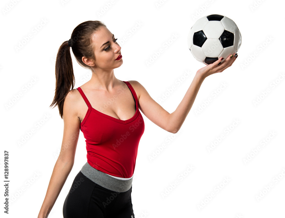 Pretty sport woman holding a soccer ball Pretty sport woman holding a soccer ball