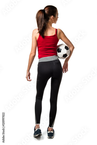 Pretty sport woman holding a soccer ball