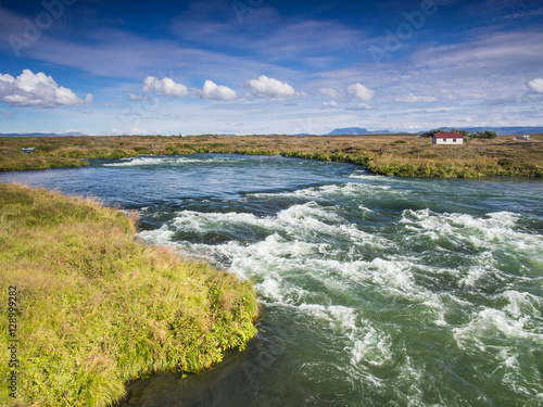 Landscape with a rushing blue river