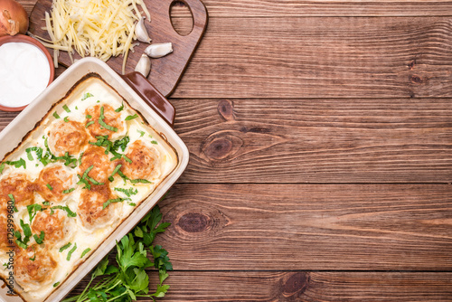 Chicken balls in cream sauce .