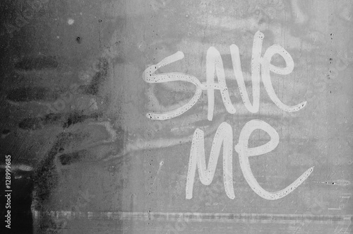 Save me message. Request for help written in water fogged glass.