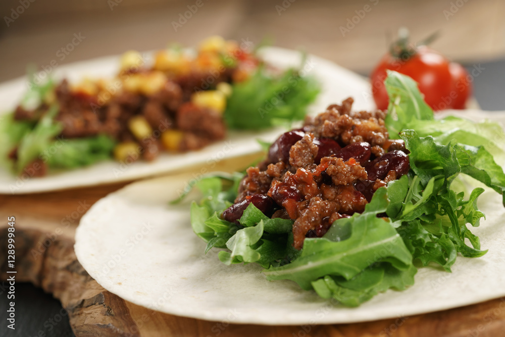 open tortilla with beef, frillice, beans and corn, organic fastfood