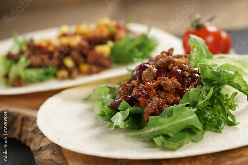 open tortilla with beef, frillice, beans and corn, organic fastfood