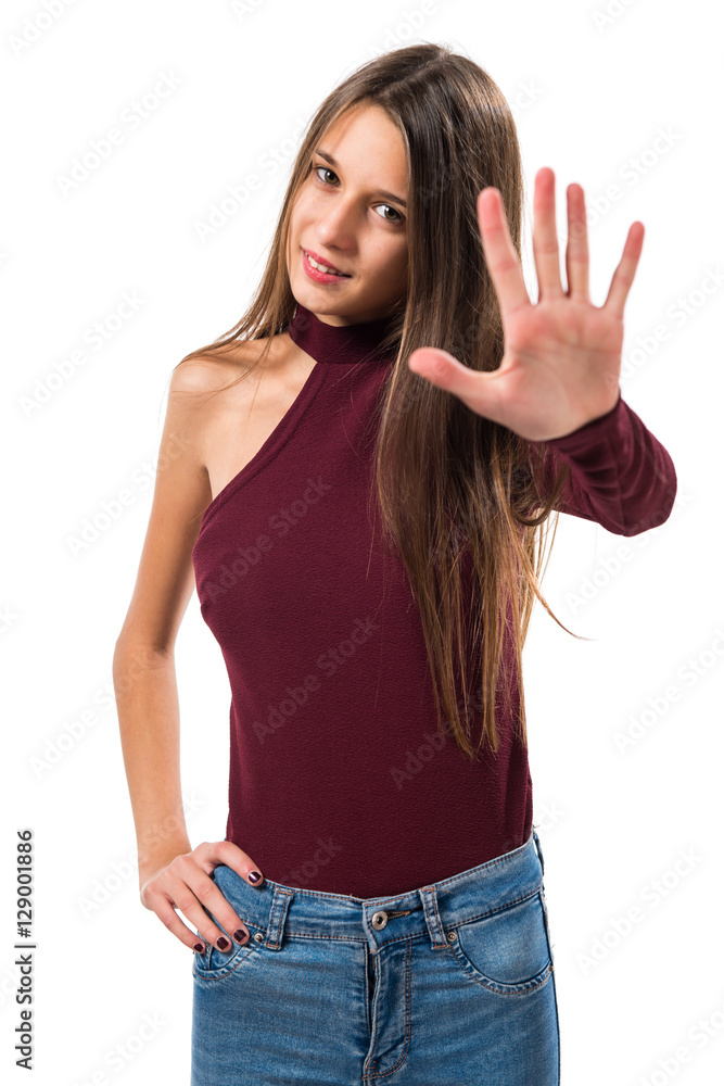 Young teenager girl counting five Young teenager girl counting five