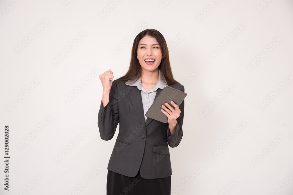 Asian businesswoman is happy with digital tablet on hand, isolat Asian businesswoman is happy with digital tablet on hand, isolat
