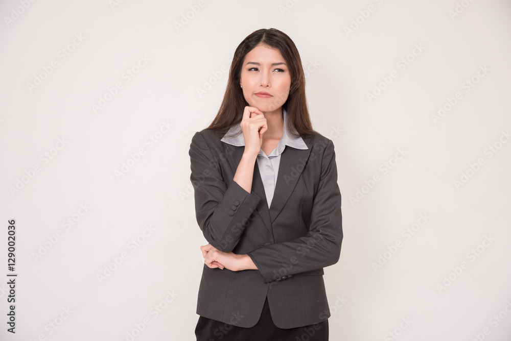 Asian businesswoman is thinking isolated on white background. Asian businesswoman is thinking isolated on white background.
