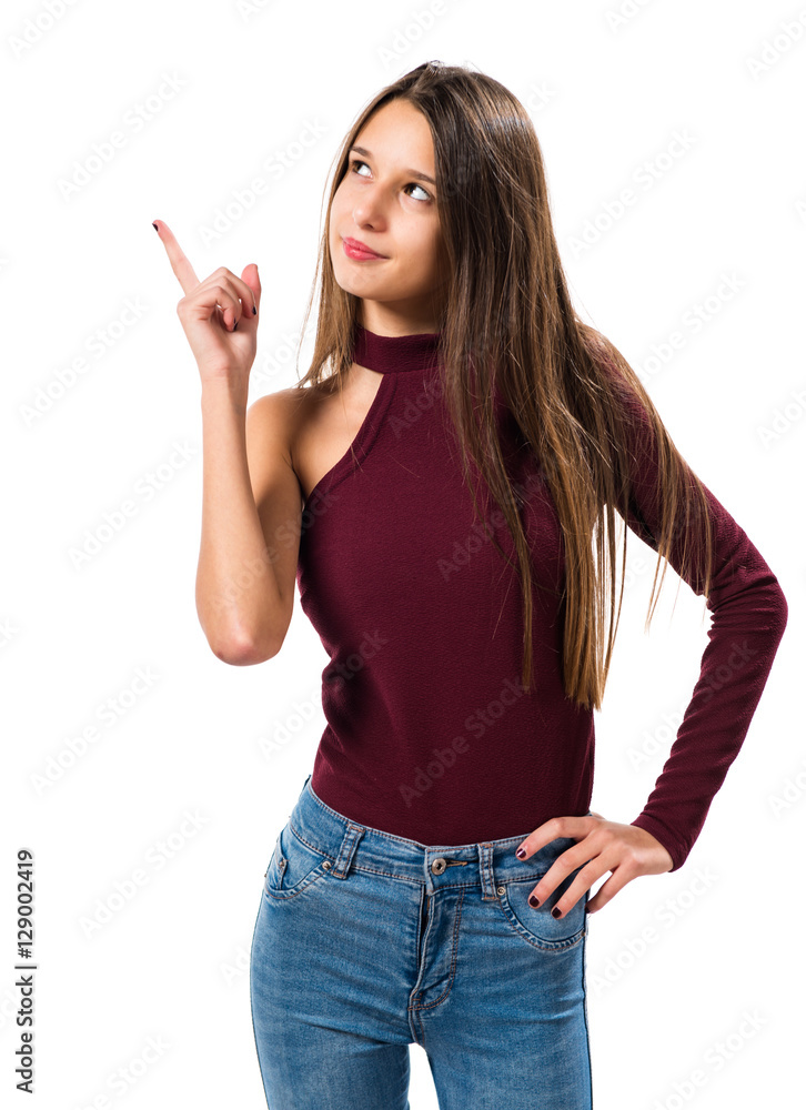 Young teenager girl pointing up Young teenager girl pointing up