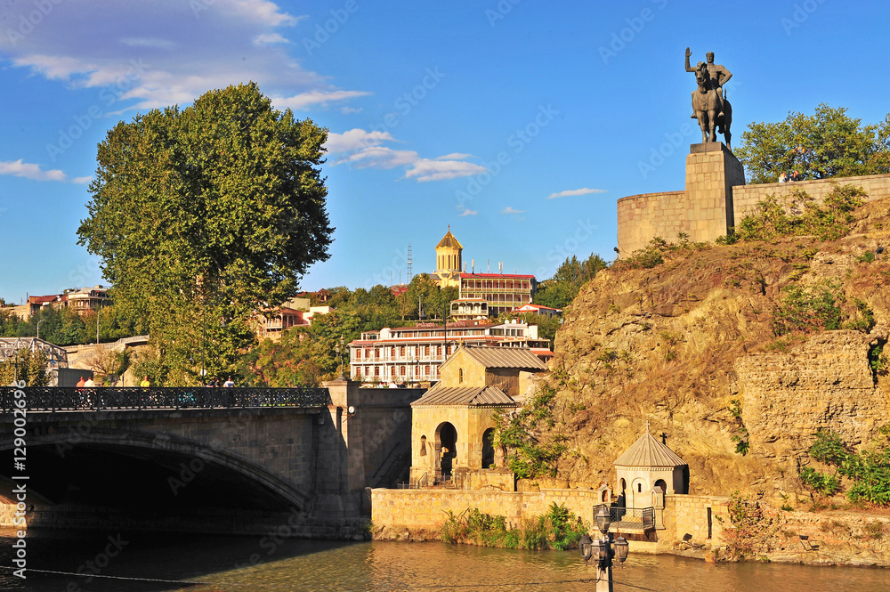 Monument and old bridge over the river in Tbilisi, Georgia