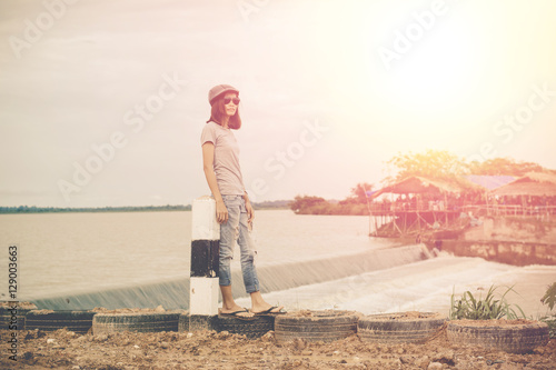 Lifestyle portrait of pretty young hipster woman making photo,po