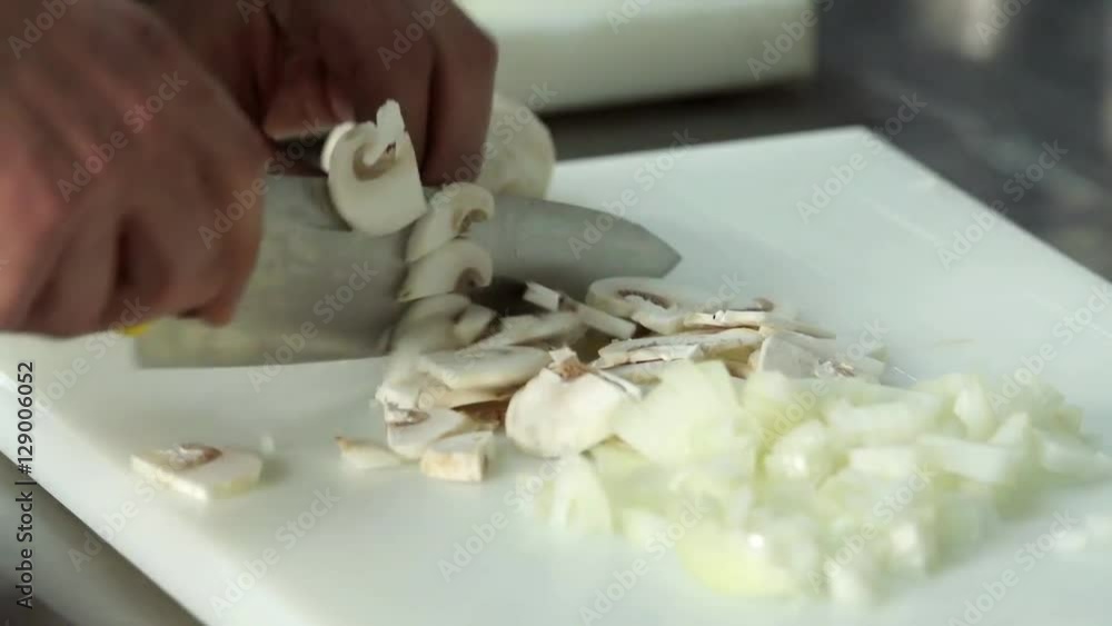 Chef hand cutting with knife champignon mushrooms 4k close up video. Food preparing in restaurant kitchen Chef hand cutting with knife champignon mushrooms 4k close up video. Food preparing in restaurant kitchen