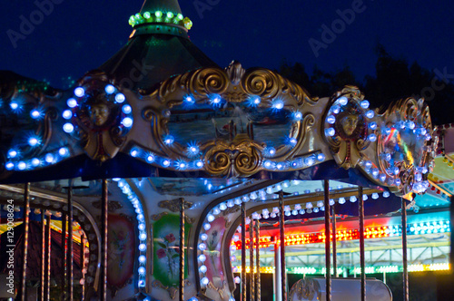 Carousel in amusement park at twilight