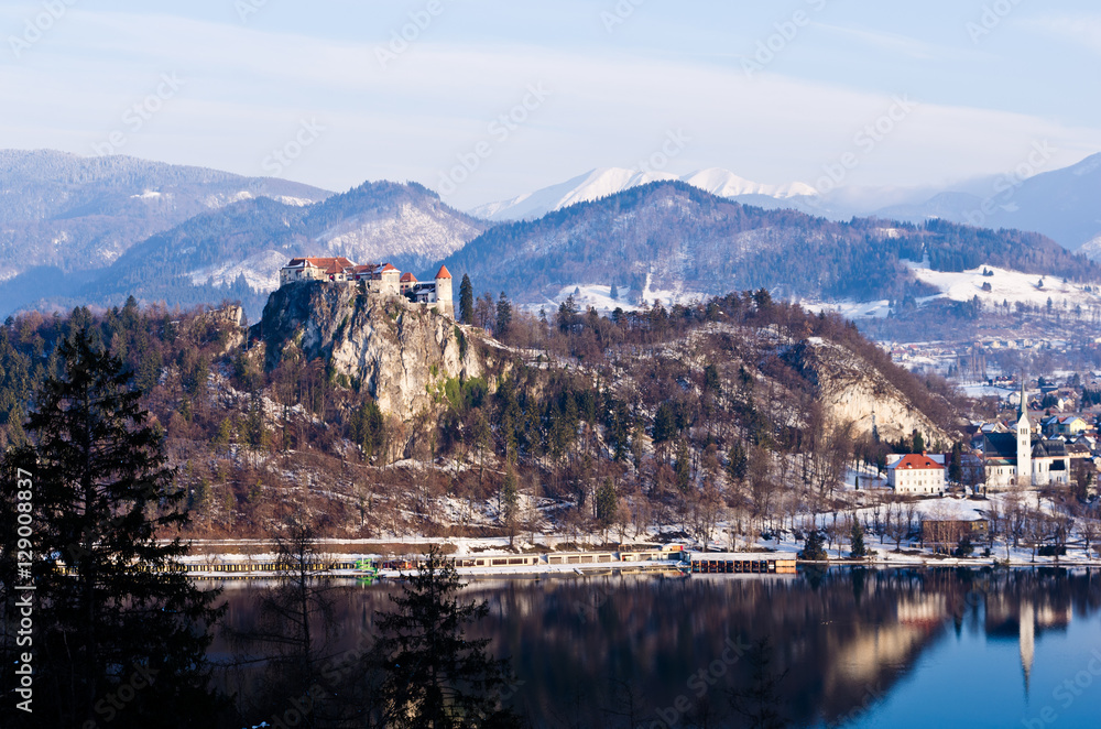 Sunny winter morning on a lake bled, a view of Bled castle with its surroundings, slovenian alps, Slovenia