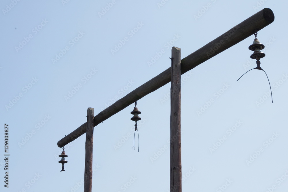 Old abandoned wooden power tower with cutted wires Old abandoned wooden power tower with cutted wires