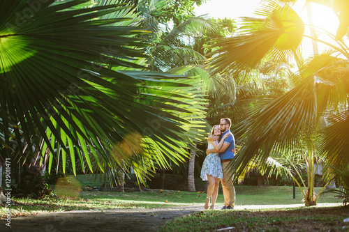 Love couple enjoy in Palm trees forest