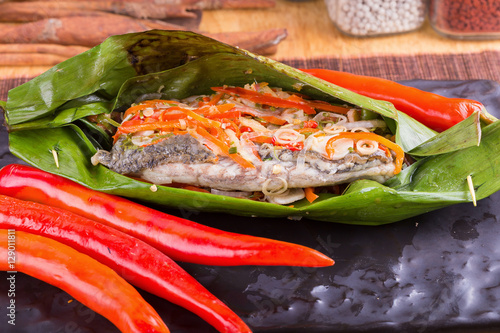 Fish curry in babana leaves. photo