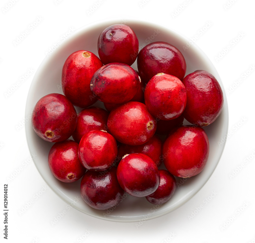 Bowl of cranberries isolated on white, from above Bowl of cranberries isolated on white, from above