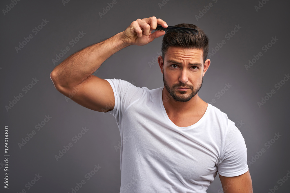 Young man with comb Young man with comb