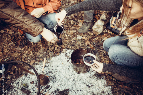 A group of people drinking tea, coffee and mulled wine in the ou