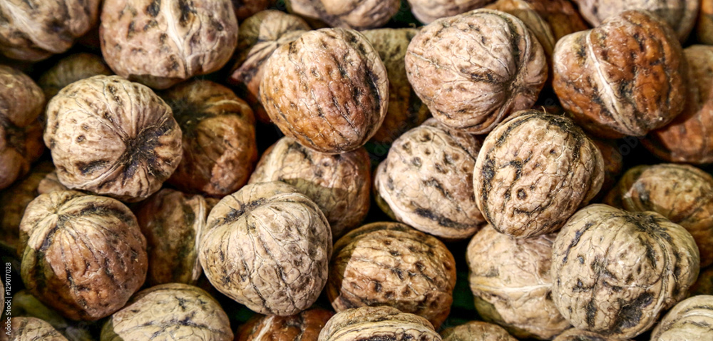 Background image of walnuts whole nuts. Background image of walnuts whole nuts.