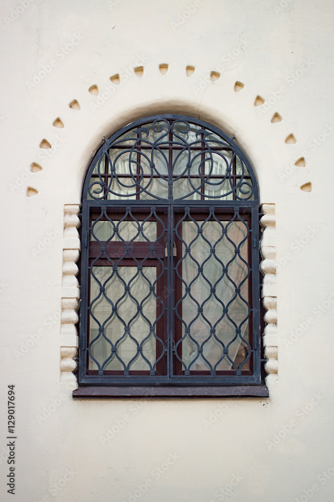 Historic window on the yellow wall Historic window on the yellow wall