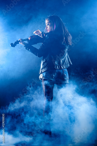 Rock Woman with Leather Jacket Playing a Violin