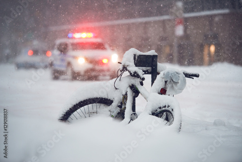 Snow storm in the city. Police car run on emergency call during snow storm in New York City. photo