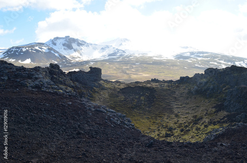 Volcanic Lava Rock and Mountains in Iceland photo