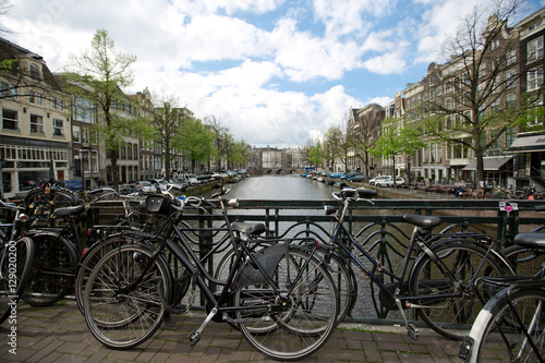Amsterdam, Naterland - APRIL 11, 2014: Bicycles park on a bridge