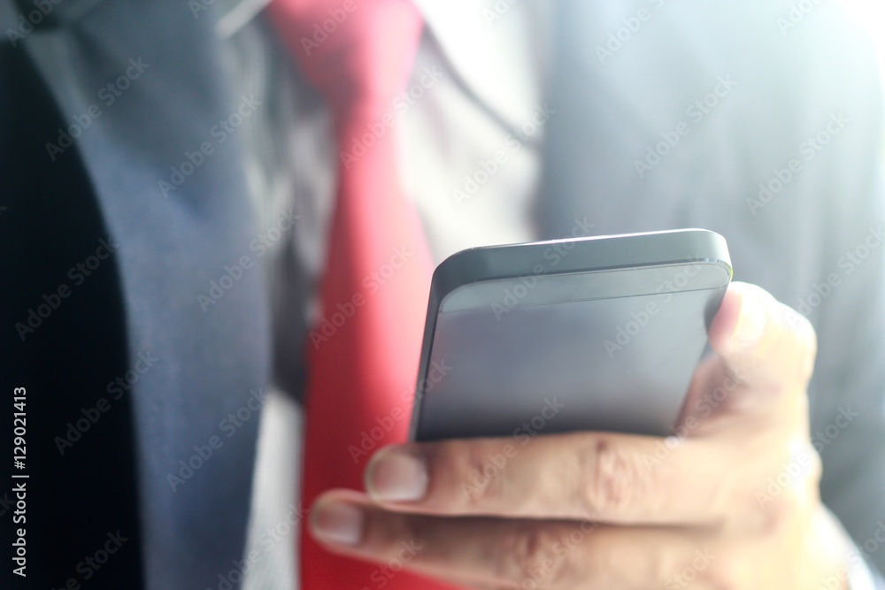 Close up of a businessman using smartphone,working on smartphone,technology concept. Close up of a businessman using smartphone,working on smartphone,technology concept.