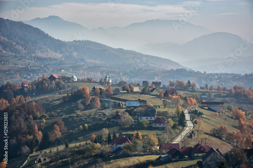 Evening sunset on mountain hills of Simon village. Bran.