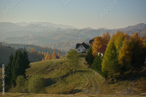 Evening sunset on mountain hills of Simon village. Bran.