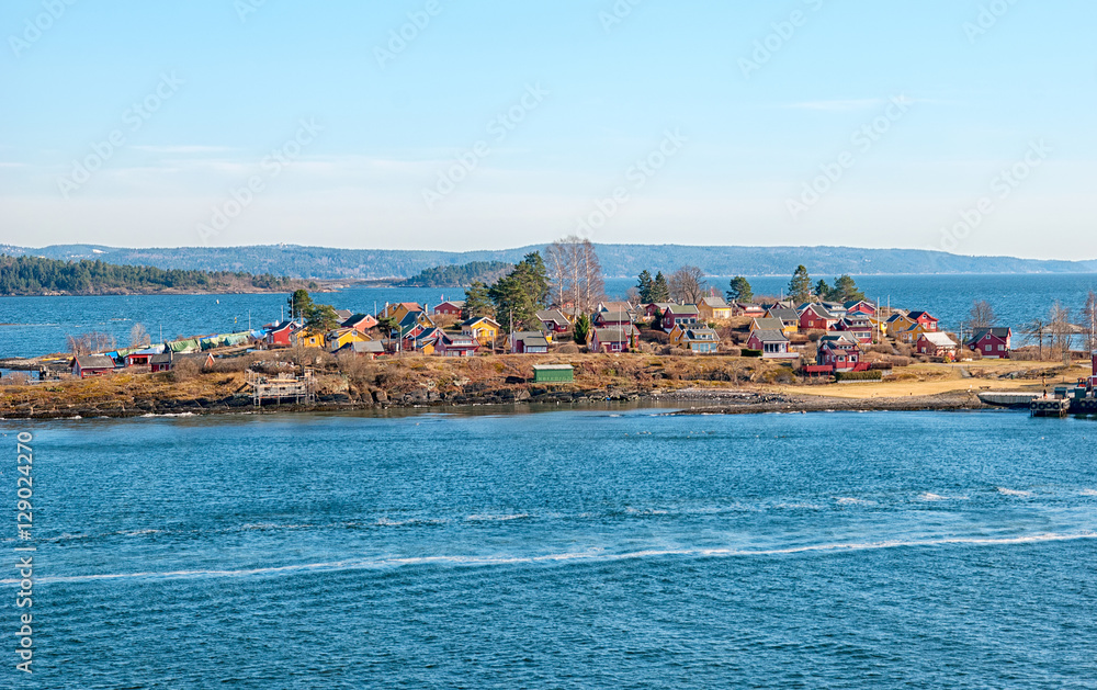Island with small colorful houses not far from Oslo. Norway