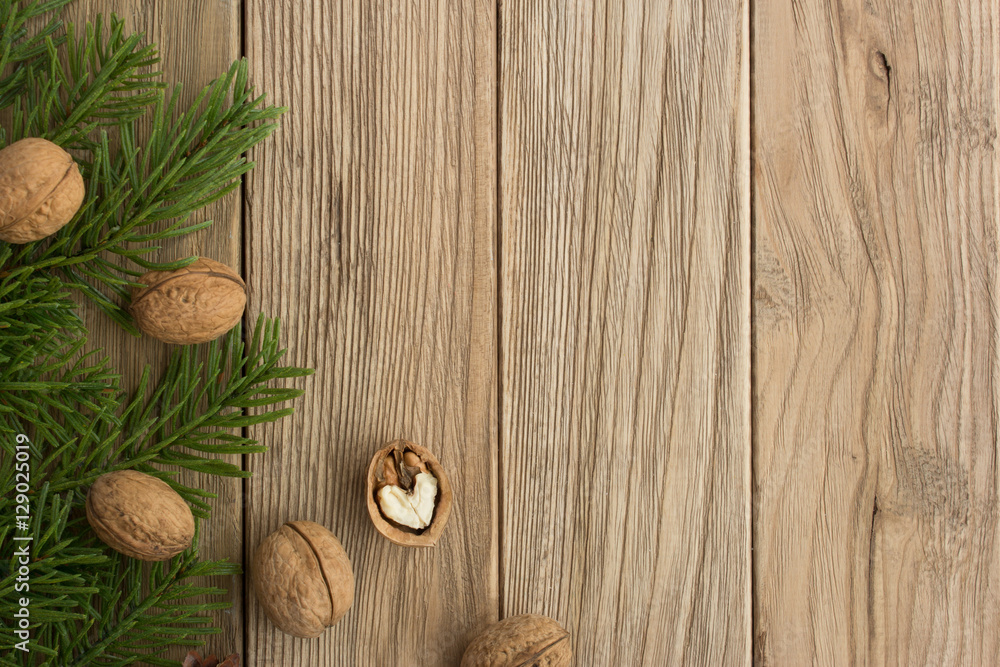 Christmas trees and nuts on a wooden table