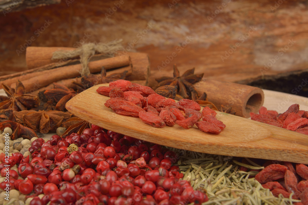 different spices on wooden background. close up different spices on wooden background. close up