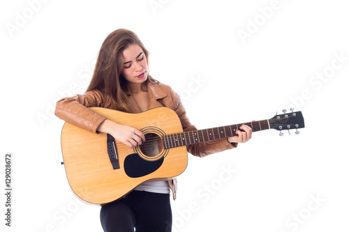 Young woman holding a guitar 