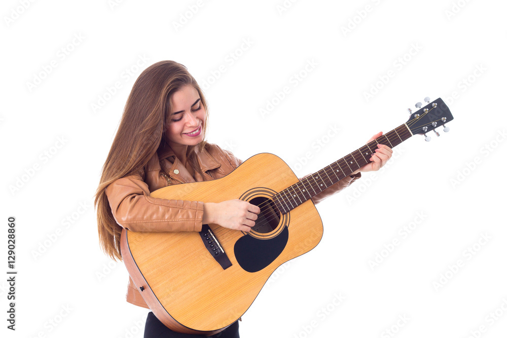 Young woman holding a guitar Young woman holding a guitar