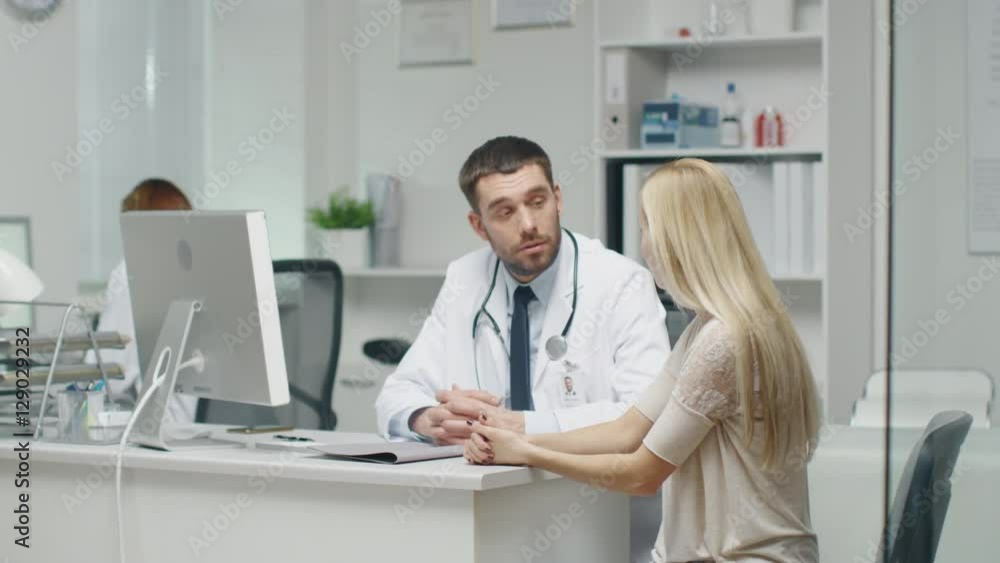 In Doctor's Office Young Woman Patient Talks to Her Male Doctor. Shot on RED Cinema Camera in 4K (UHD). In Doctor's Office Young Woman Patient Talks to Her Male Doctor. Shot on RED Cinema Camera in 4K (UHD).