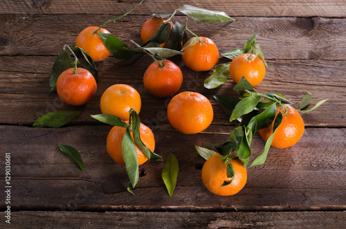 Mandarins Tangerines on wooden background. Free space for your text.