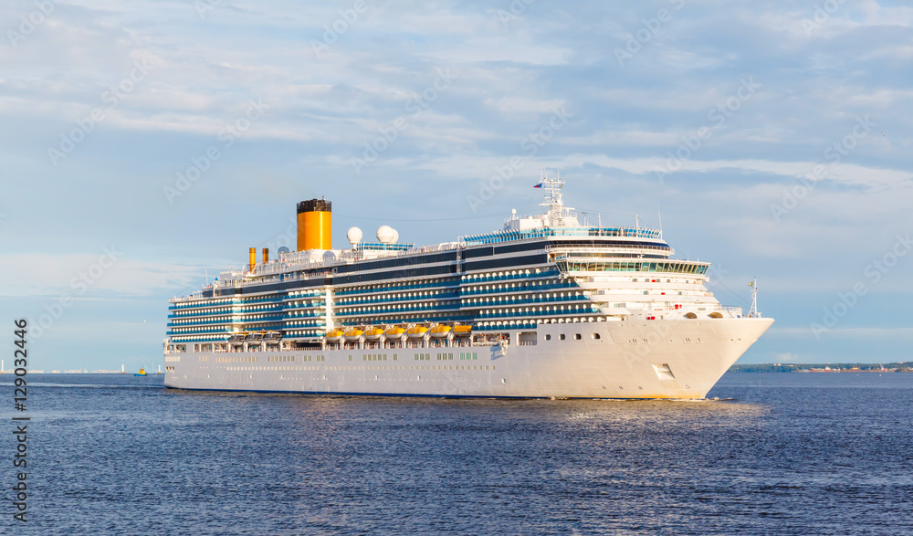 White cruise ship passes barrage gates Gulf of Finland