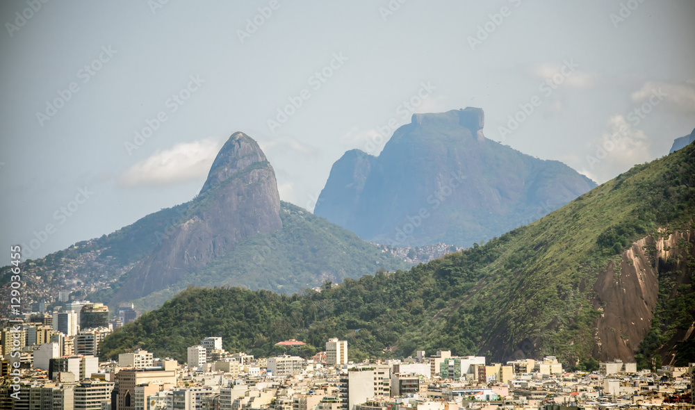 View of Copacabana district on the background of Vidigal distict, Dois Irmaos Mountain and Pedra da Gavea, Rio de Janeiro, Brazil